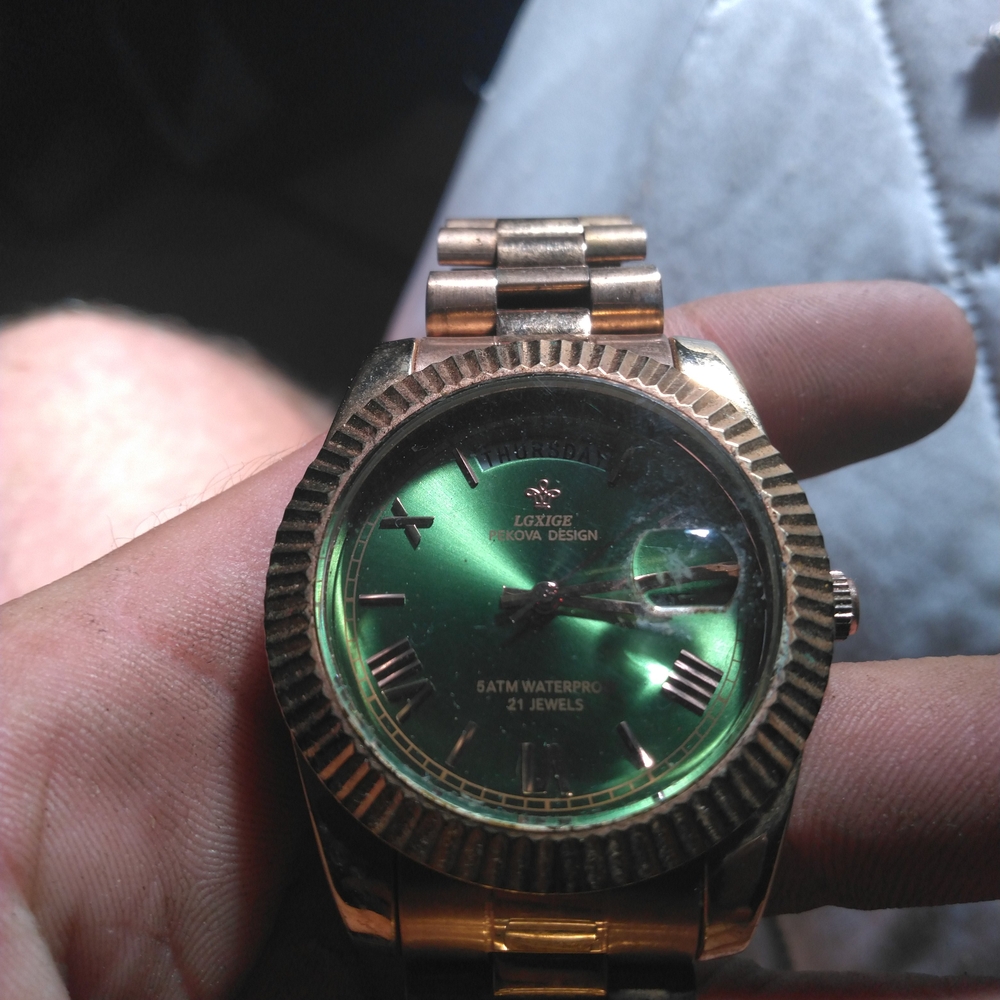Gold and Green Logince Watch